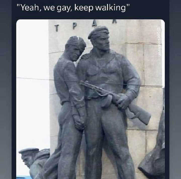 The meme is a screenshot of a photo of two men in a romantic embrace, with the caption "In 2-3 sentences, describe this meme for someone who cannot see it" at the top. The text at the bottom reads: "In 2-3 sentences, describe this meme for someone who cannot see it: The image is a photo of two men in a romantic embrace, with the caption 'In 2-3 sentences, describe this meme for someone who cannot see it'. The image is actually a photo of a statue of two men in a romantic embrace, with the caption 'In 2-3 sentences, describe this meme for someone who cannot see it'."